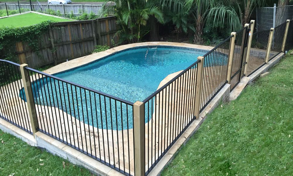 Flat-top Pool Fencing between timber posts